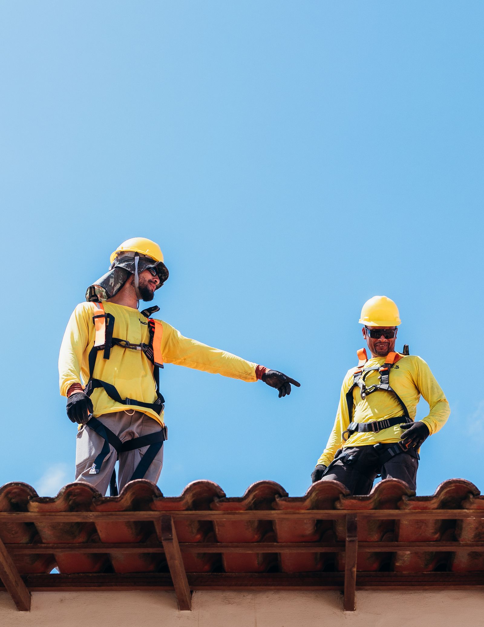 Roofing crew on a residential roof as part of a complete installation.
